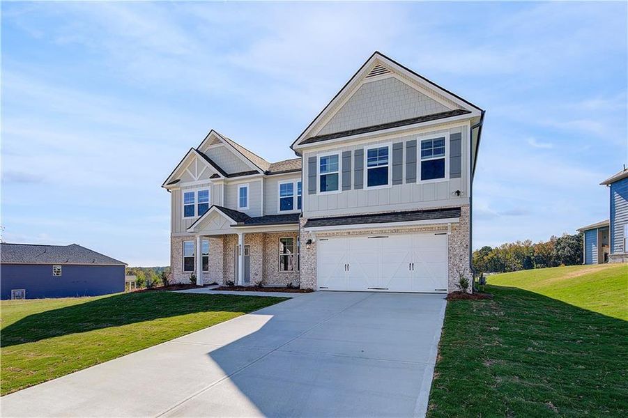 Front exterior of a new home in Grandview at Millers Mill, Stockbridge, GA, highlighting curb appeal (Image 17). Front exterior of a new home in Grandview at Millers Mill, Stockbridge, GA, highlighting curb appeal (Image 17).