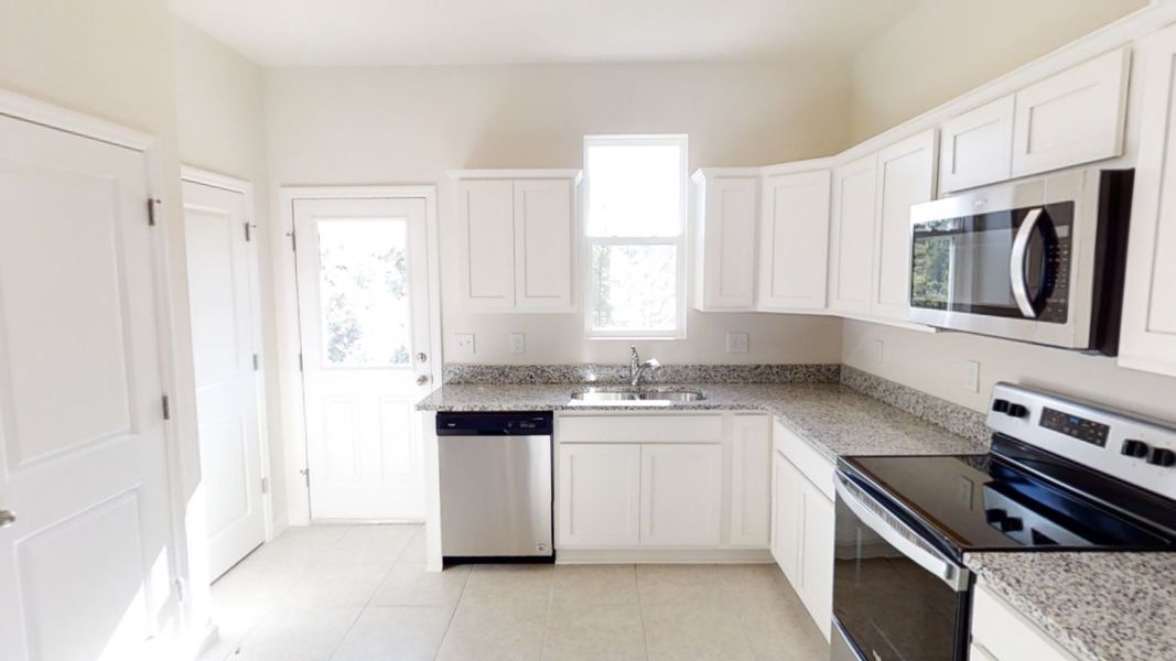 Representative furnished interior of a home built from the Atlantis by Starlight Homes in Landings at Mount Olive, Polk City (Image 3). Representative furnished interior of a home built from the Atlantis by Starlight Homes in Landings at Mount Olive, Polk City (Image 3).