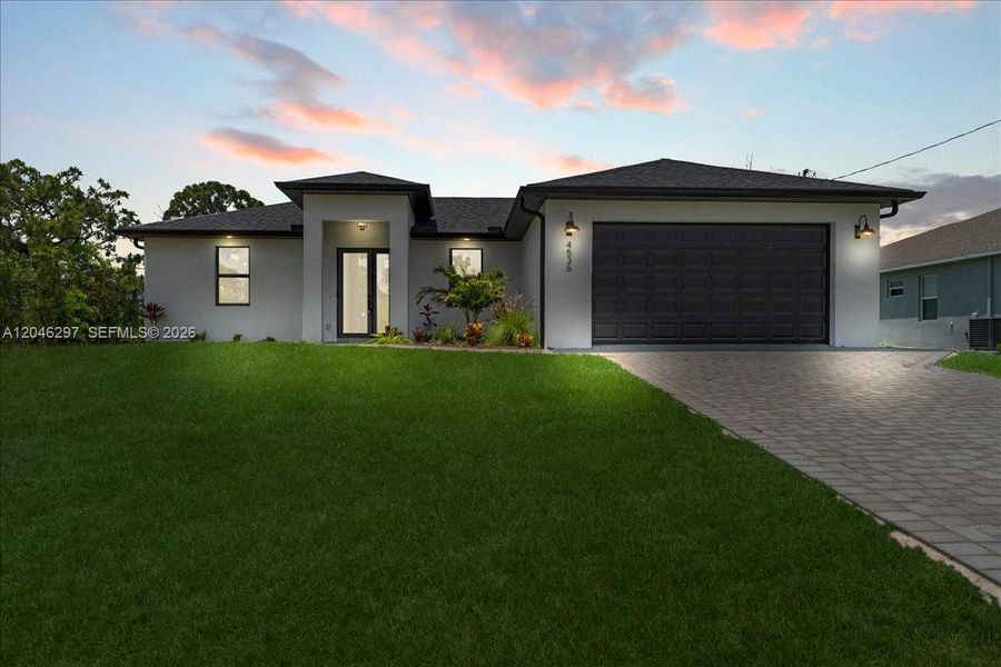 Front exterior of a new home in , Cape Coral, FL, highlighting curb appeal (Image 23). Front exterior of a new home in , Cape Coral, FL, highlighting curb appeal (Image 23).