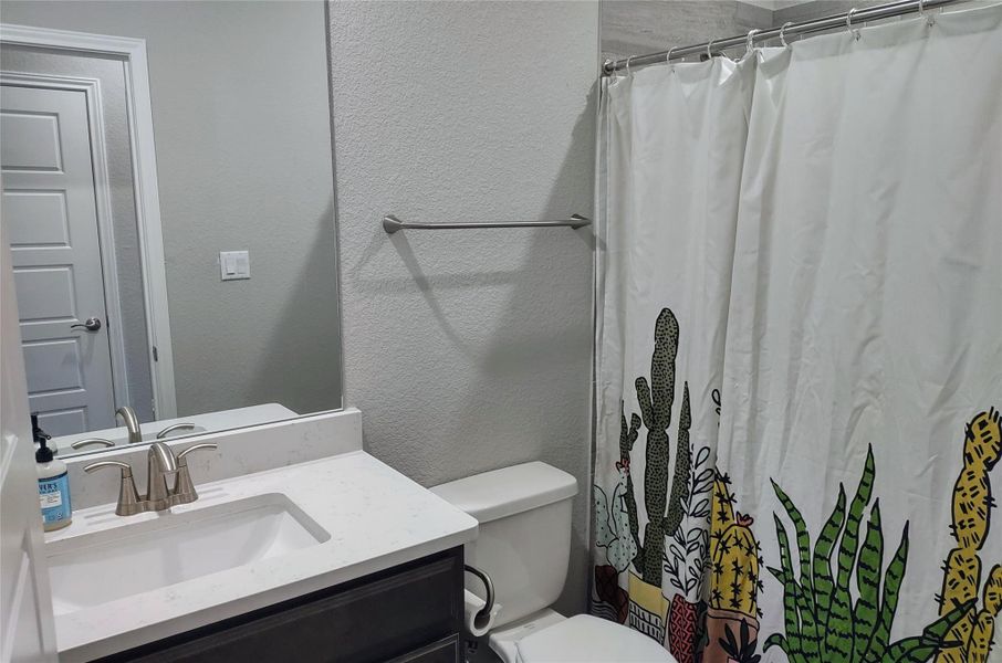 Full bath featuring vanity