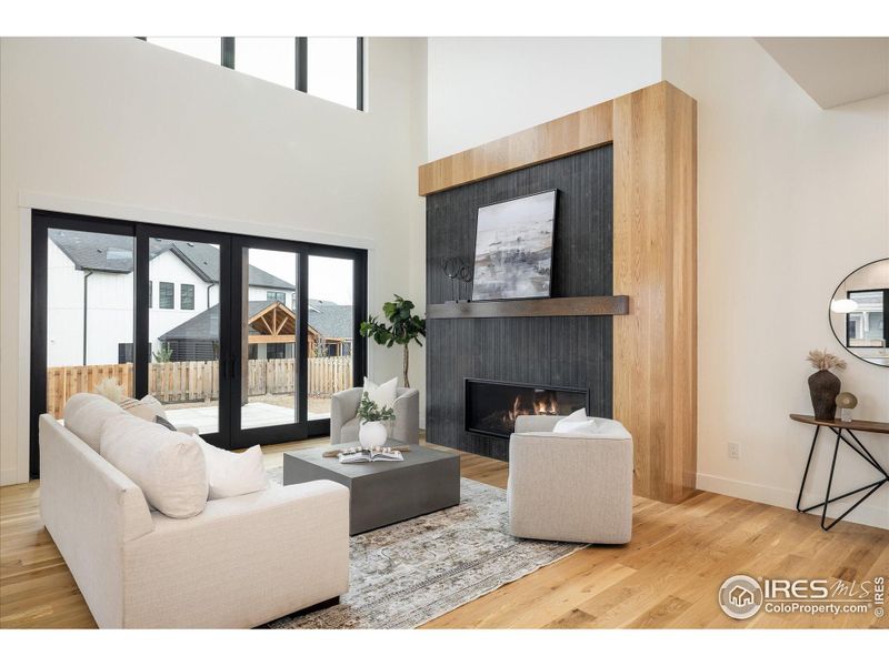 This beautiful Great Room allows for indoor/outdoor entertaining with large sliding doors onto the pergola-covered patio