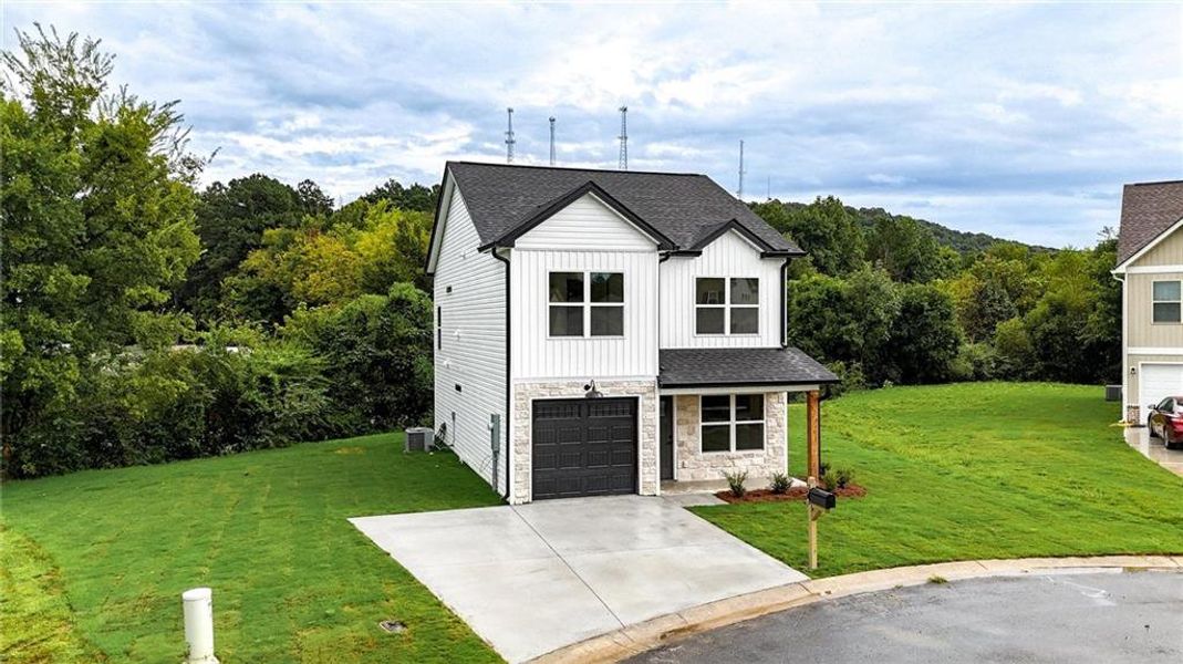 Front exterior of a new home in , Calhoun, GA, highlighting curb appeal (Image 19).