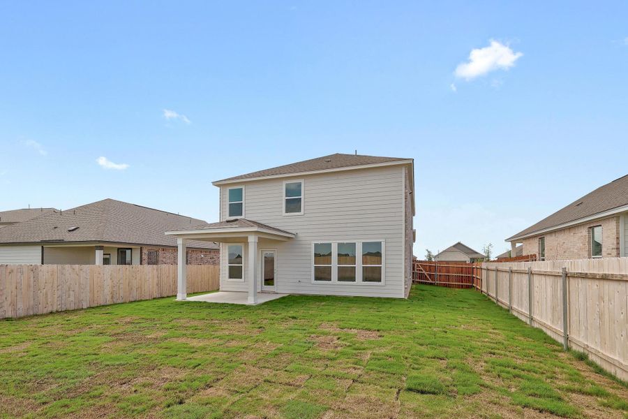 Front exterior of a new home in Salerno - Heritage Collection, Round Rock, TX, highlighting curb appeal (Image 2).
