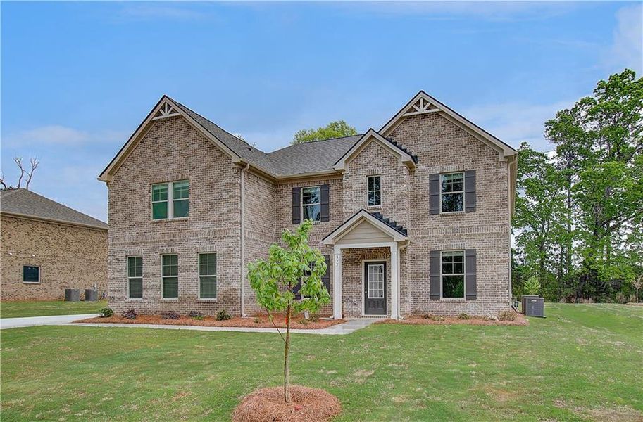 Front exterior of a new home in Cambria at Traditions, Hampton, GA, highlighting curb appeal (Image 2).