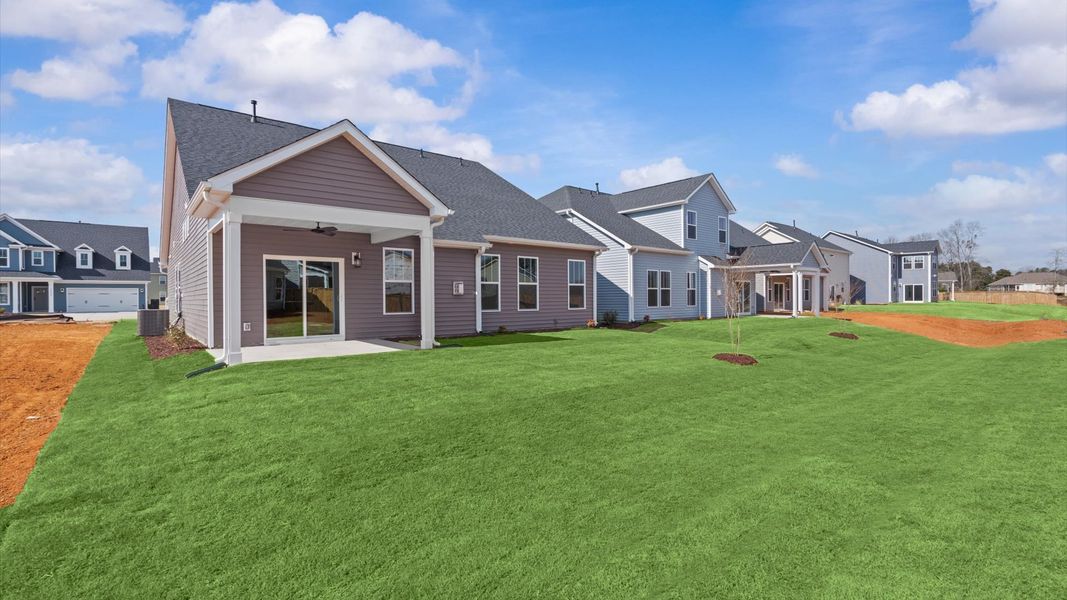 Refined rear exterior with a stylish covered porch for dining, relaxing, or entertaining