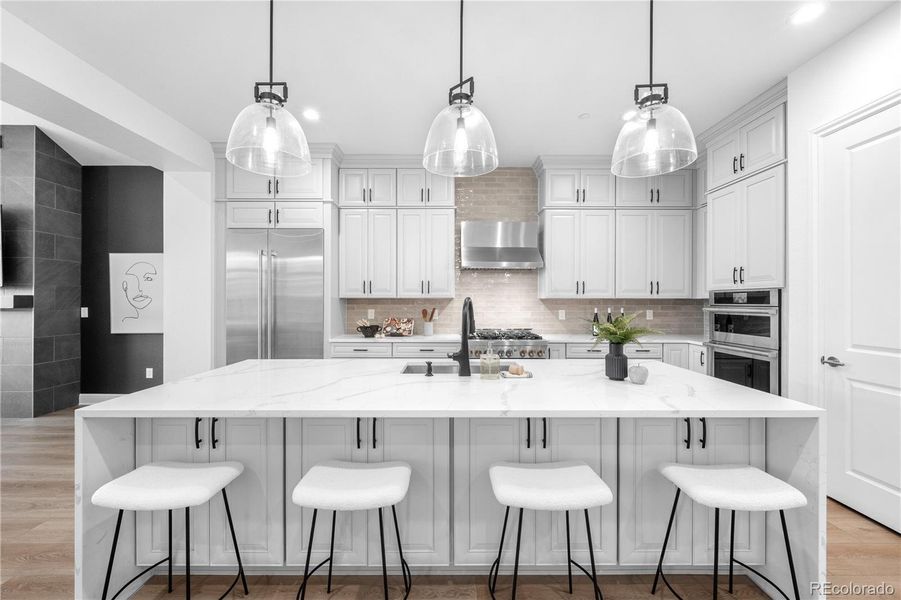 Waterfall island with eat-in seating and generous storage