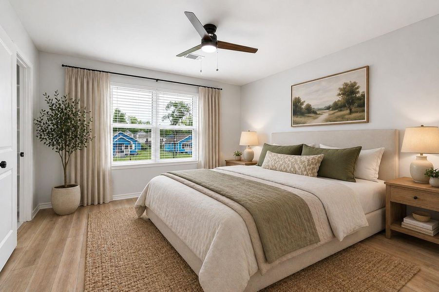 The primary bedroom offers a warm and inviting atmosphere, enhanced by a neutral color palette and abundant natural light from a large window. The space comfortably accommodates a full range of furnishings, while a ceiling fan provides added comfort and circulation.The en-suite retreat features a spacious closet and a private bathroom complete with dual vanities and a generously sized walk-in shower, creating a functional and relaxing space for everyday living. (Photo virtually staged