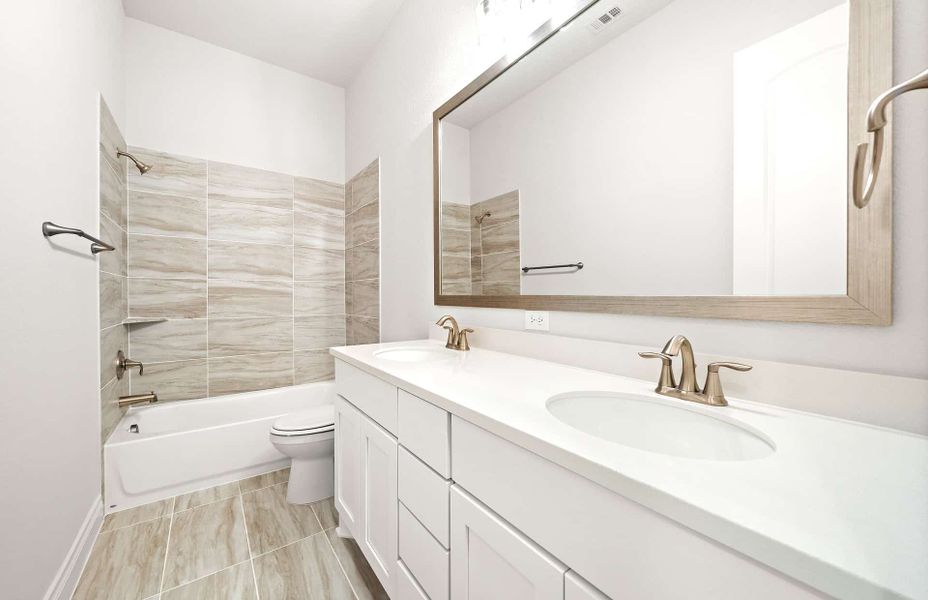 Representative furnished interior of a home built from the 2406 by Ravenna Homes in The Highlands 55′, Porter (Image 18).