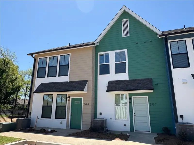 Front exterior of a new home in Avenue at Oakland City, Atlanta, GA, highlighting curb appeal (Image 1).
