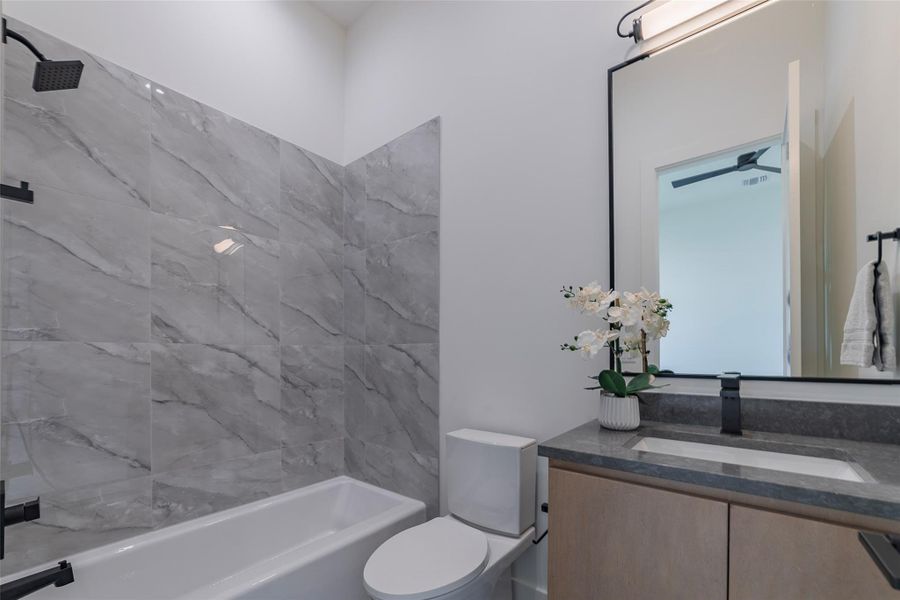 Full bath with vanity and tub / shower combination