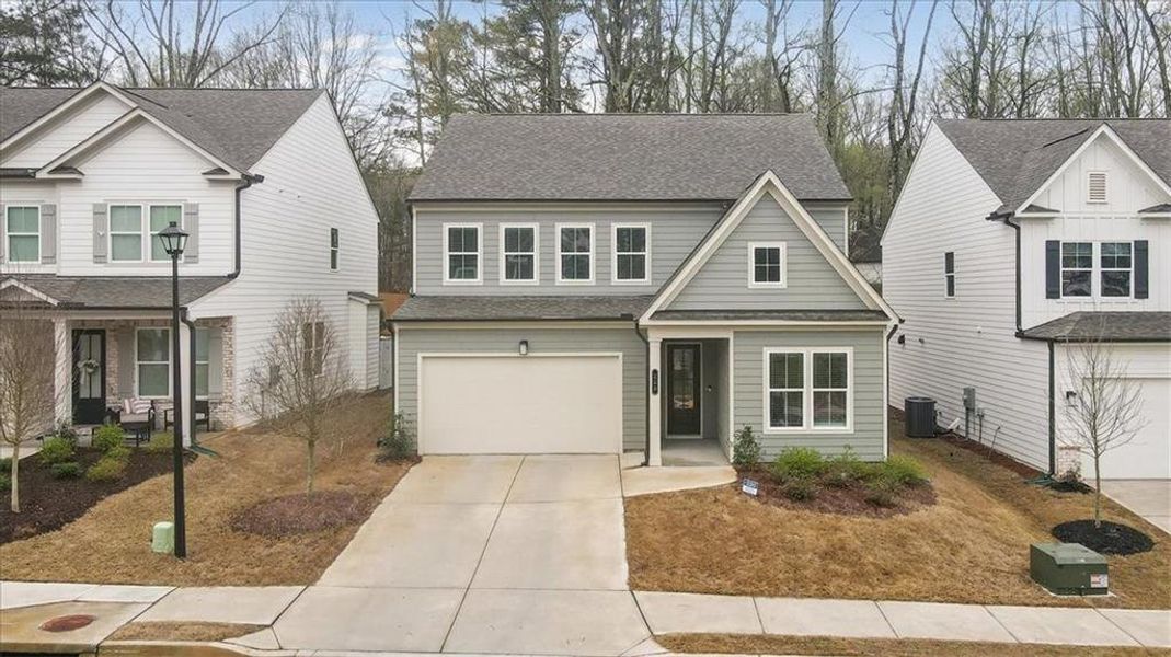 Front exterior of a new home in Enclave at Edgewater, Holly Springs, GA, highlighting curb appeal (Image 25).