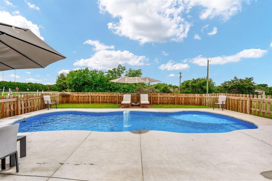 Pool has the holes in the concrete for additional safety fence around pool.