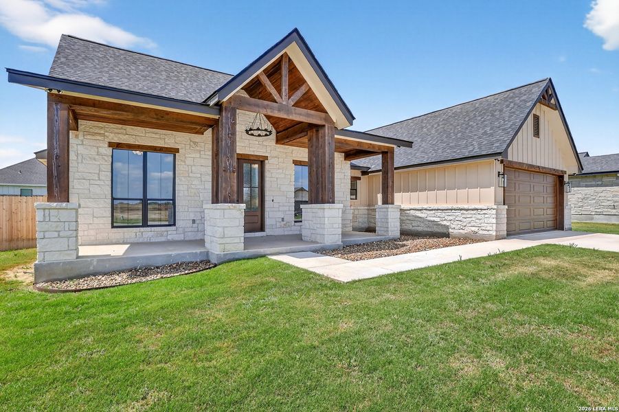Front exterior of a new home in , Poth, TX, highlighting curb appeal (Image 26).