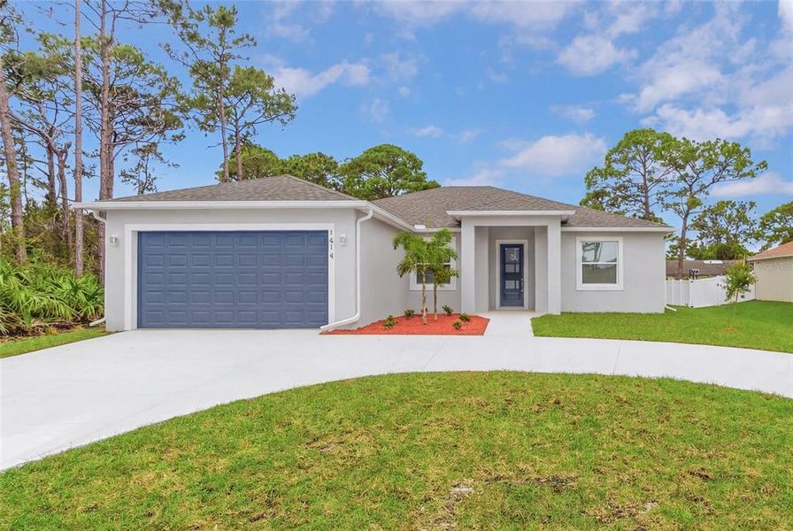 Front exterior of a new home in , Palm Bay, FL, highlighting curb appeal (Image 24).