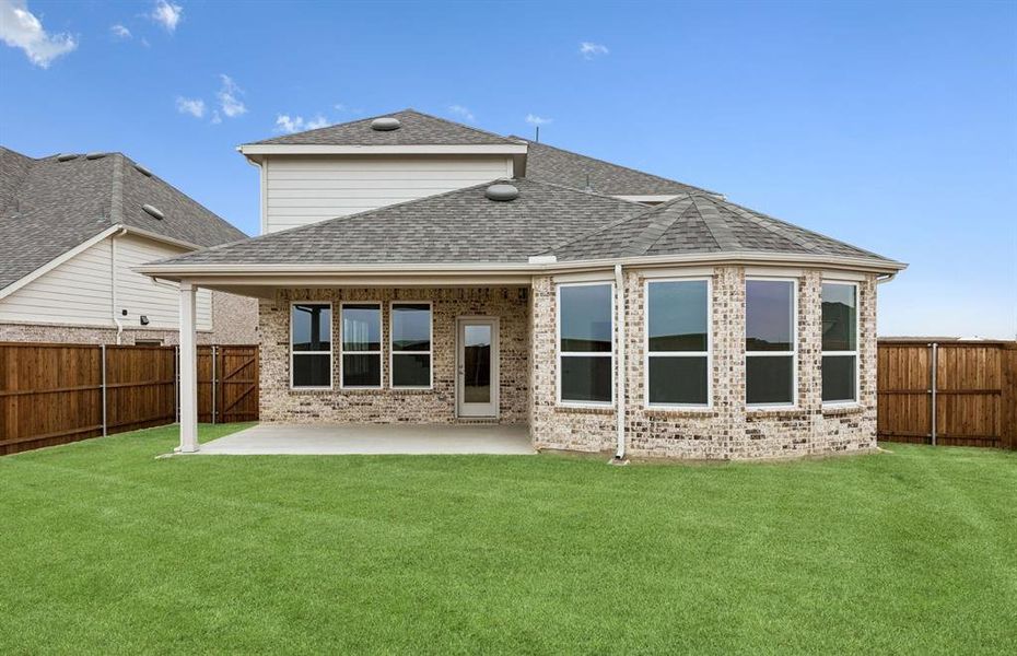 Back of home with covered patio
