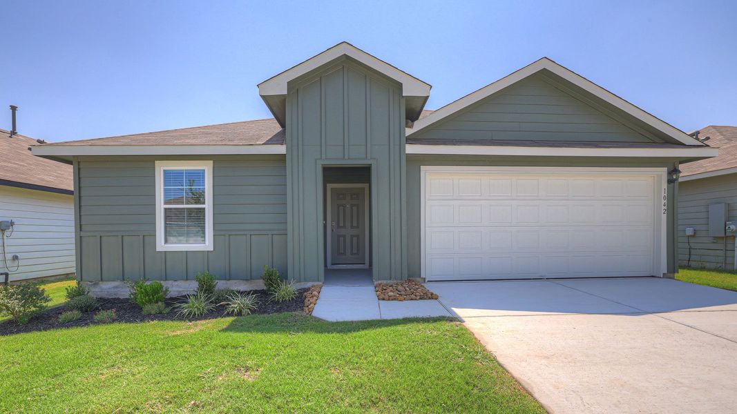Front exterior of a new home in Navarro Fields, Seguin, TX, highlighting curb appeal (Image 2). Front exterior of a new home in Navarro Fields, Seguin, TX, highlighting curb appeal (Image 2).