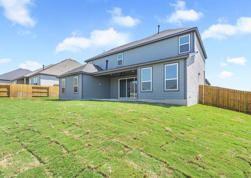 The back yard is spacious with plenty of space for children and pets to run and play. The back yard is spacious with plenty of space for children and pets to run and play.