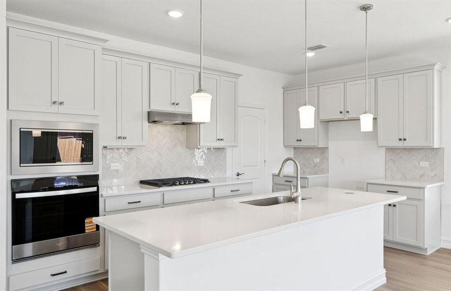 Spacious kitchen with eat-in bar top island