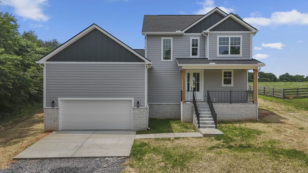 Front exterior of a new home in Judah Hills, Portland, TN, highlighting curb appeal (Image 1).