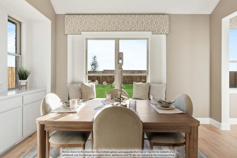 Dining room with wood table, upholstered chairs, bench seating, and large window overlooking backyard