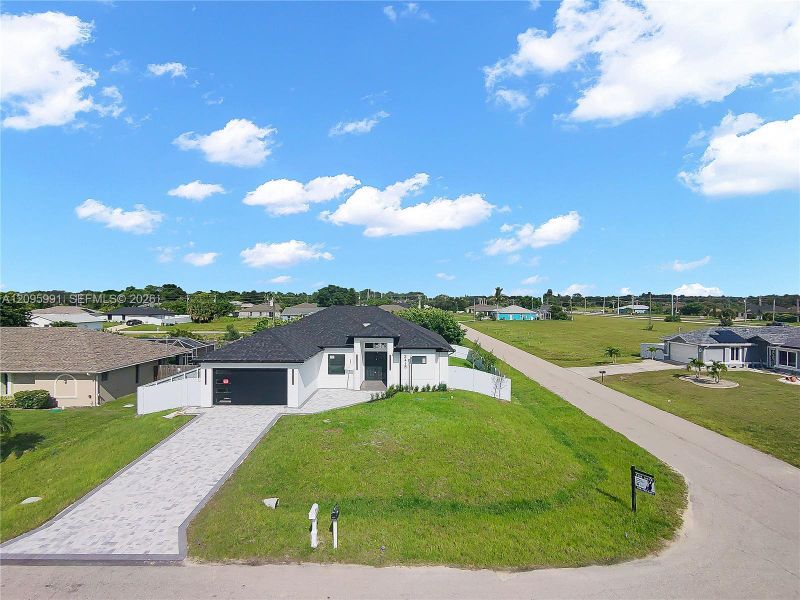 Front exterior of a new home in , Cape Coral, FL, highlighting curb appeal (Image 26).