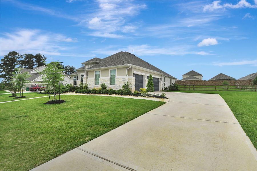 Front exterior of a new home in Lone Star Landing, Montgomery, TX, highlighting curb appeal (Image 23).