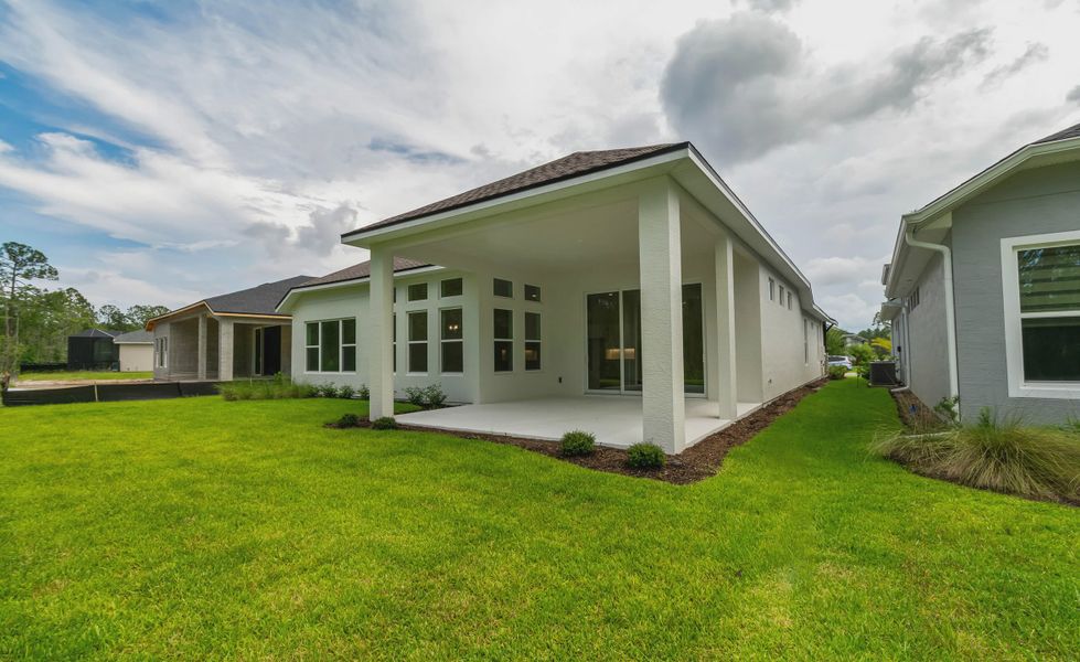 Exterior details and patio area of a home in Woodhaven, Port Orange (Image 3).