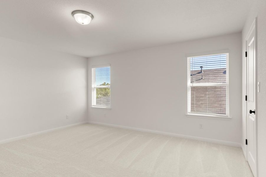 Spare room with light colored carpet and baseboards Spare room with light colored carpet and baseboards