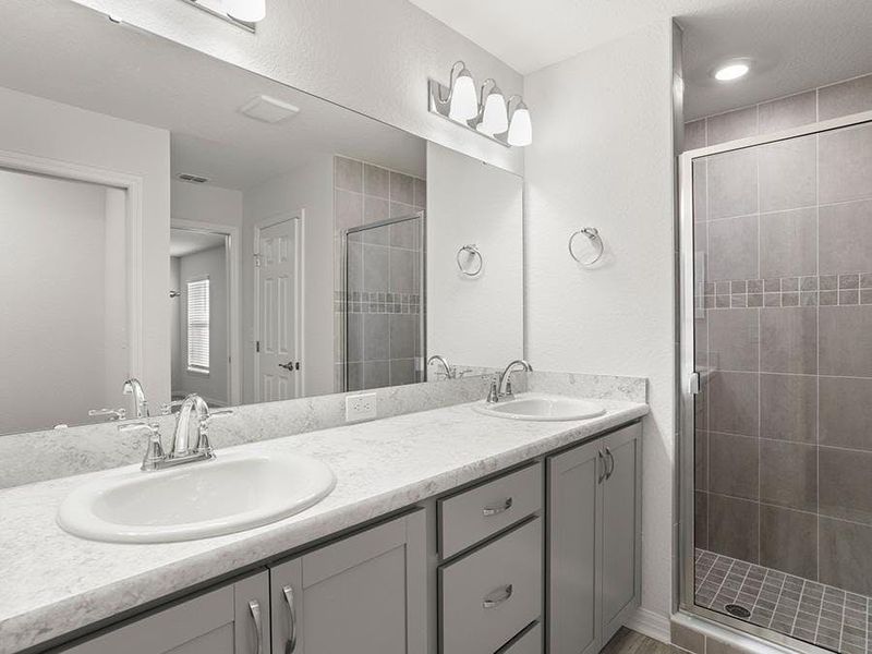 Your suite is complete with an en-suite bath including a large tiled shower (optional garden tub available) - Paisley by Highland Homes