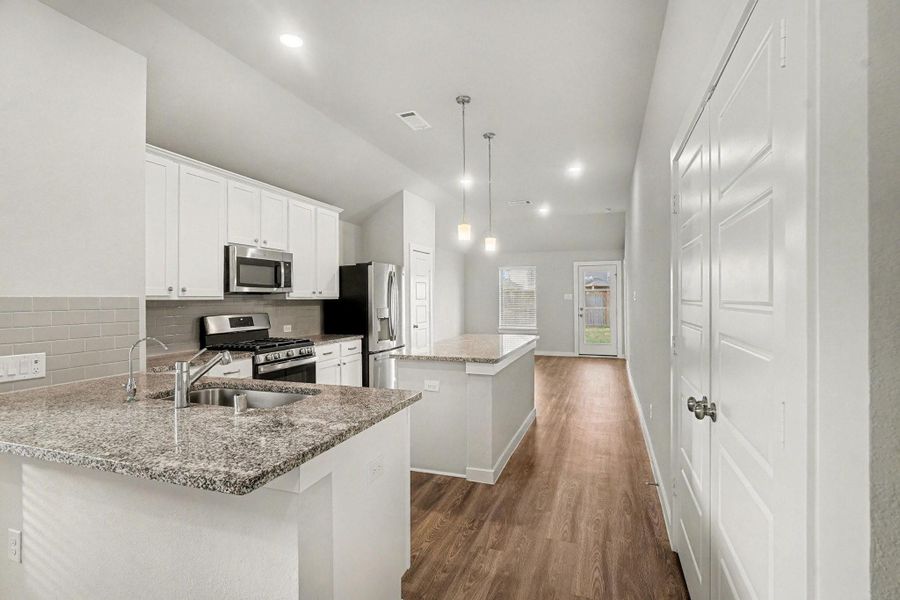 Amazing kitchen features beautiful countertops, a massive center island, stainless steel appliances, and much more. (Refrigerator is included) Amazing kitchen features beautiful countertops, a massive center island, stainless steel appliances, and much more. (Refrigerator is included)