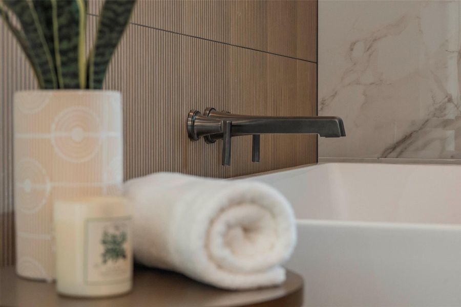 Bathroom view of a tub to relax in and a sink