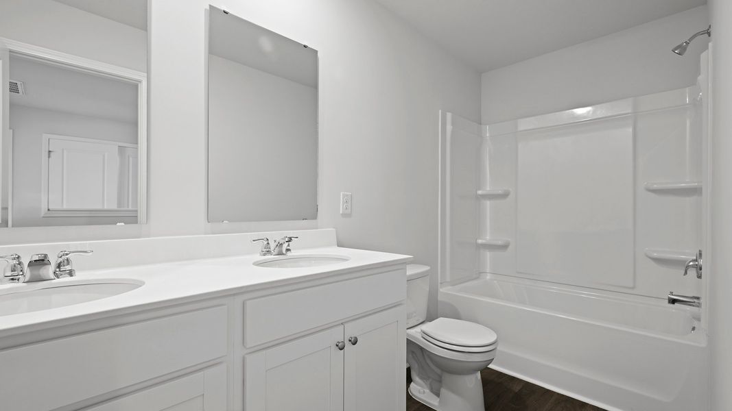 Furnished interior view inside a new home in Pine Hills Townhomes at Cane Bay, Summerville (Image 9).