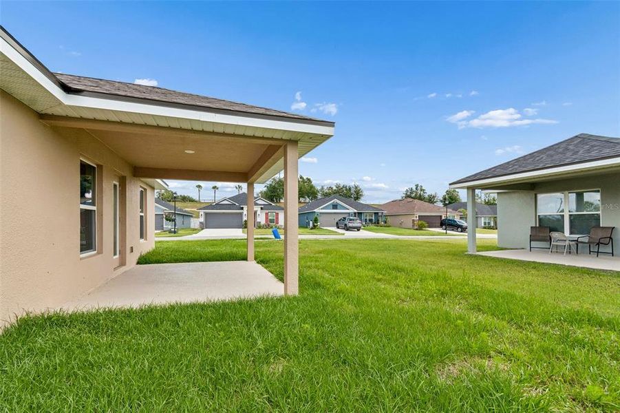 Exterior details and patio area of a home in Abbey Glen, Dade City (Image 36).