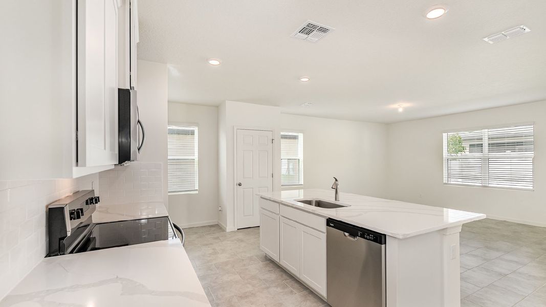 Representative furnished interior of a home built from the Hayden by D.R. Horton in Morningside, Fort Pierce (Image 5).