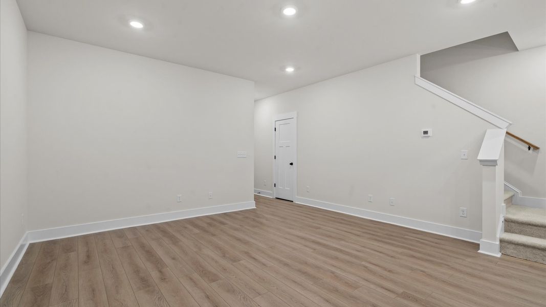 Exceptional family room featuring tasteful finishes and vibrant natural light near Downtown Greenville