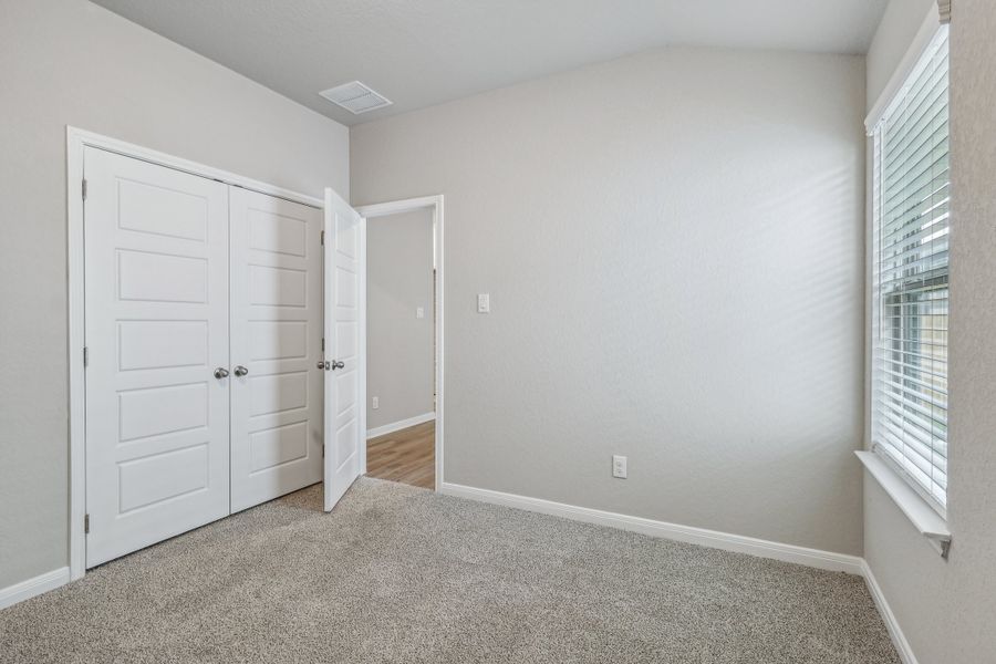 Guest bedroom in the Allen floorplan at a Meritage Homes community. Guest bedroom in the Allen floorplan at a Meritage Homes community.
