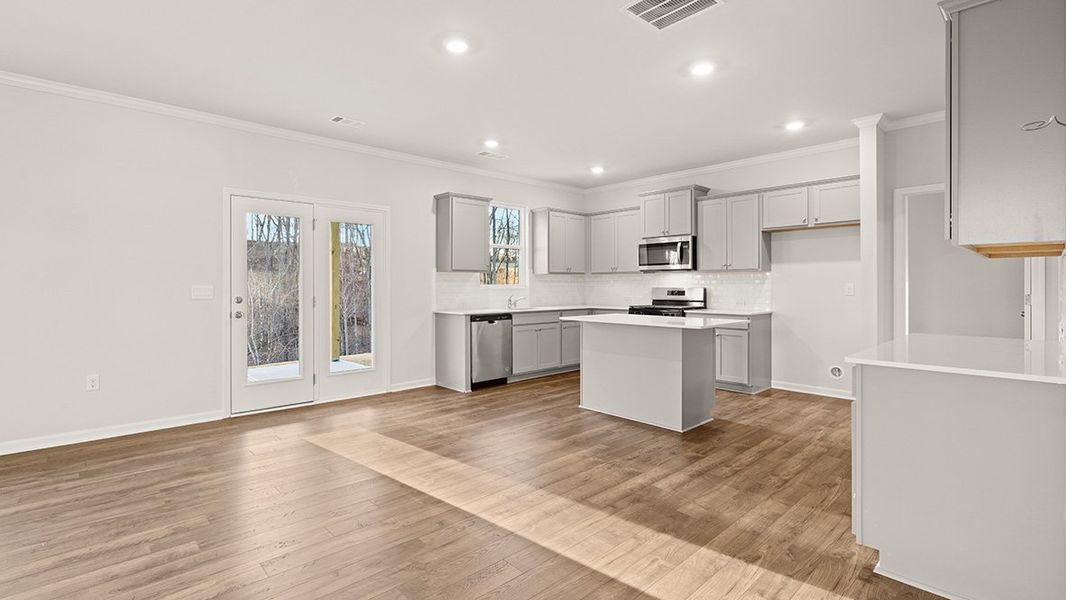 Representative furnished interior of a home built from the Mansfield by D.R. Horton in Liberty Crossing, Braselton (Image 6).
