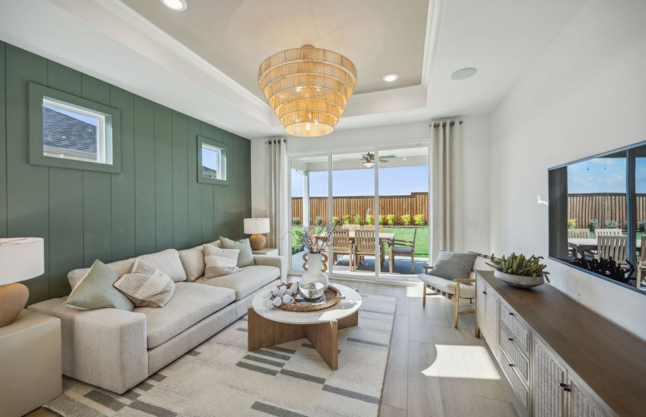 Spacious gathering room with tray ceiling