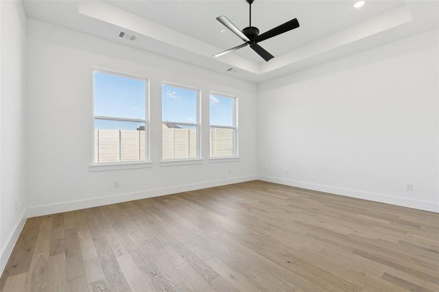 Located at the rear of the home for added privacy, this spacious owner's suite was designed for rest and relaxation.