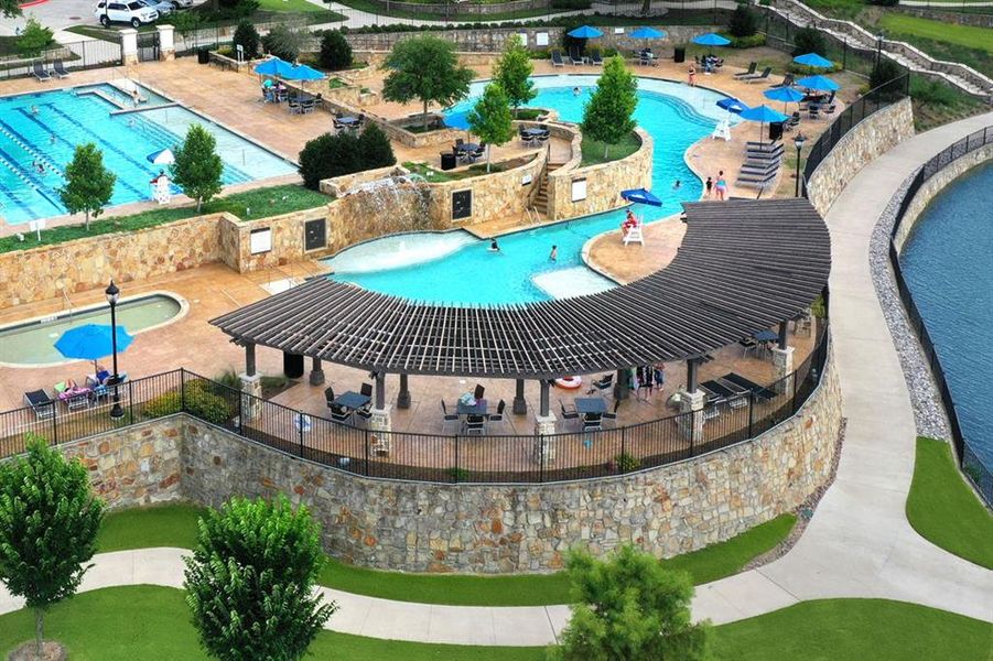 Community pool featuring a patio