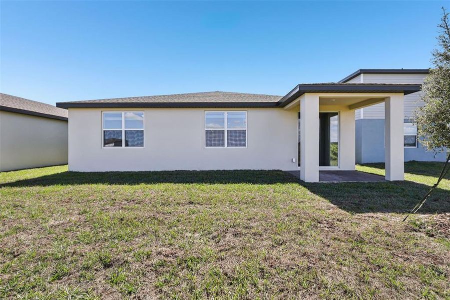 Exterior details and patio area of a home in Lake Deer Estates - Signature Series, Poinciana (Image 22).