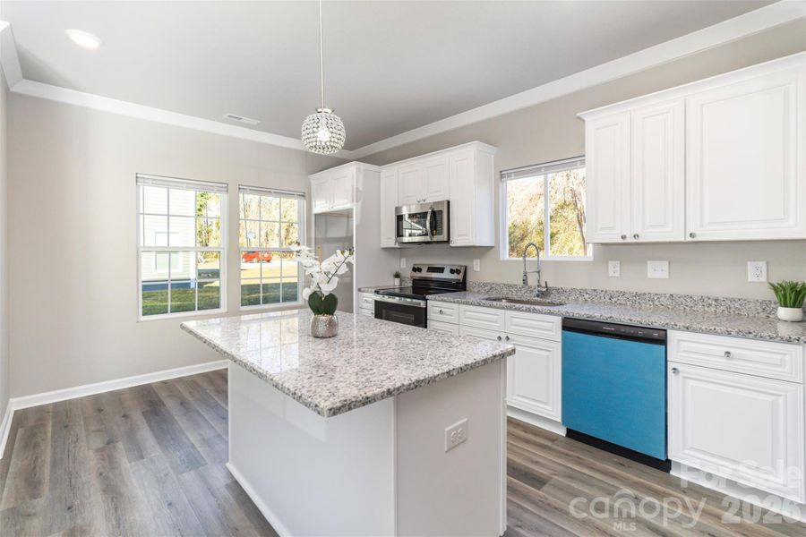 Spacious granite island, protective film left on new appliances for new owners Spacious granite island, protective film left on new appliances for new owners