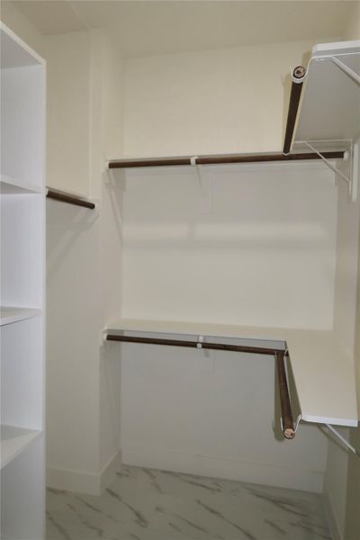 Walk in closet for bedroom 3.