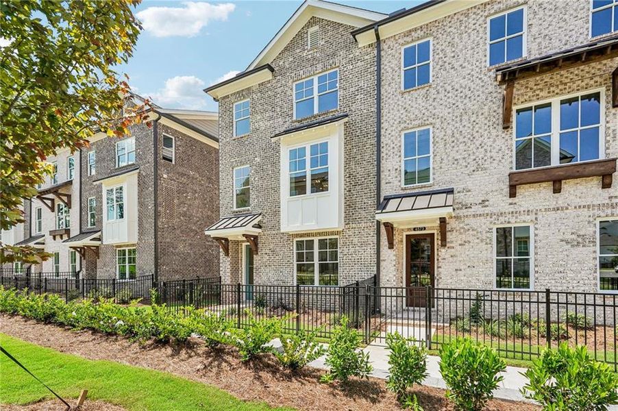 Exterior details and patio area of a home in Waterside Townhomes, Peachtree Corners (Image 25). Exterior details and patio area of a home in Waterside Townhomes, Peachtree Corners (Image 25).