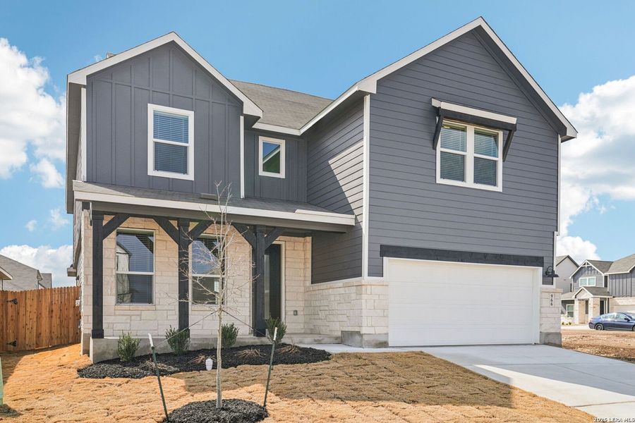 Front exterior of a new home in Estancia Ranch - Classic Series, San Antonio, TX, highlighting curb appeal (Image 21).