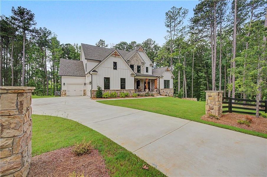 Front exterior of a new home in Ford Landing, Acworth, GA, highlighting curb appeal (Image 28). Front exterior of a new home in Ford Landing, Acworth, GA, highlighting curb appeal (Image 28).