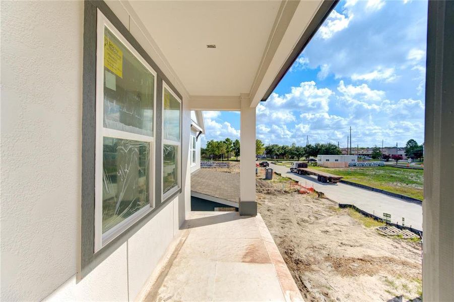 Step out onto this cozy balcony to take in the views of the developing neighborhood. This outdoor space is perfect for enjoying your morning coffee or evening relaxation, offering a private retreat with a connection to the community. **This image is from another Saratoga Home - Artemis floorplan.**