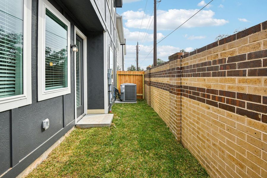 Exterior details and patio area of a home in Spring Brook Village - City Series, Houston (Image 27).