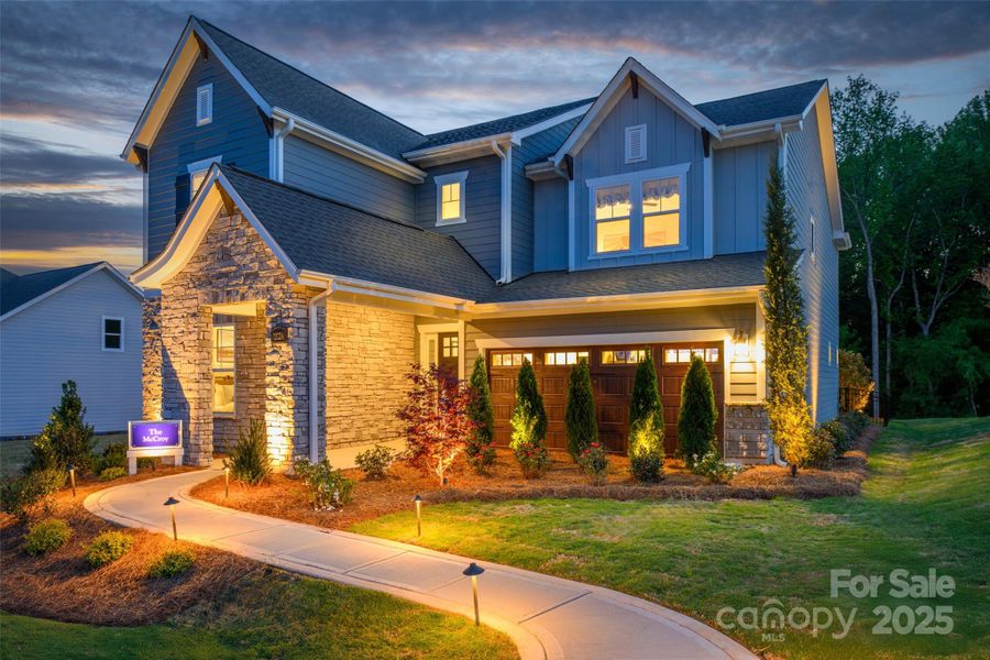 Front exterior of a new home in North Creek Village, Huntersville, NC, highlighting curb appeal (Image 1).