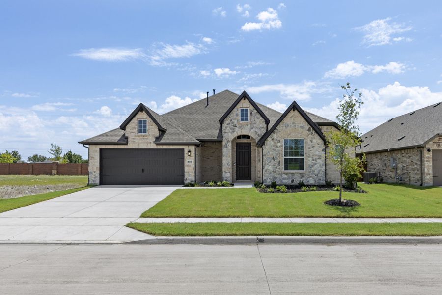 Front exterior of a new home in River Ranch, Van Alstyne, TX, highlighting curb appeal (Image 1). Front exterior of a new home in River Ranch, Van Alstyne, TX, highlighting curb appeal (Image 1).